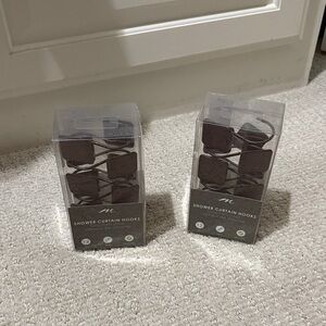 Oil rubbed bronze shower curtain hooks.